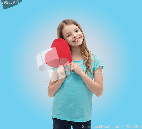 Image of smiling little girl with red heart