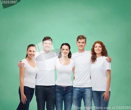 Image of group of smiling teenagers in white blank t-shirts