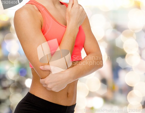 Image of sporty woman with pain in elbow