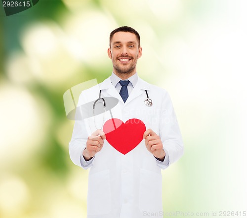 Image of smiling male doctor with red heart