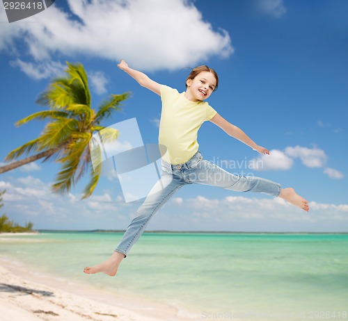 Image of smiling little girl jumping