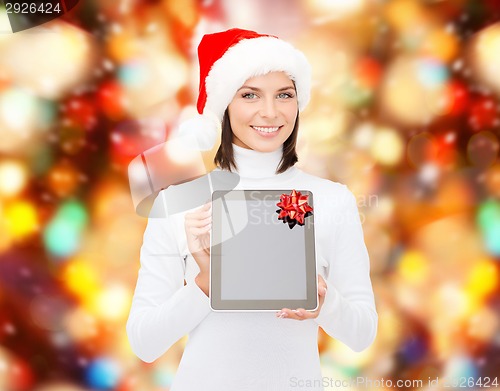 Image of woman in santa helper hat with tablet pc