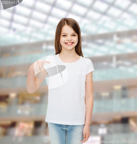Image of smiling little girl in white blank t-shirt