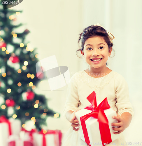 Image of happy child girl with gift box