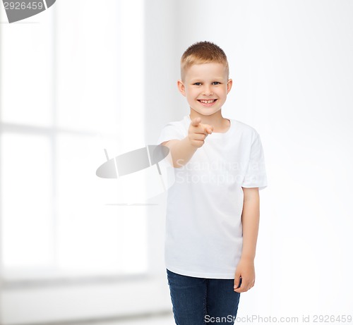 Image of smiling little boy in white blank t-shirt