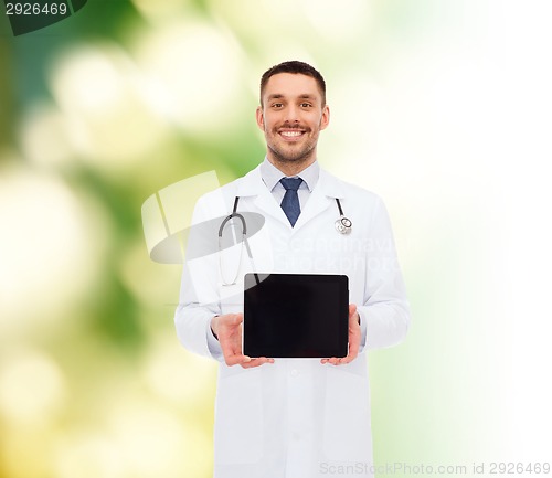 Image of smiling male doctor with tablet pc