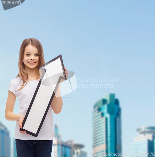 Image of smiling little girl with blank arrow pointing up