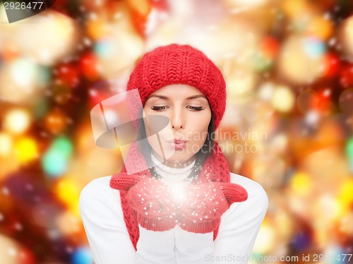 Image of smiling young woman in winter clothes