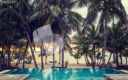 Image of swimming pool on tropical beach