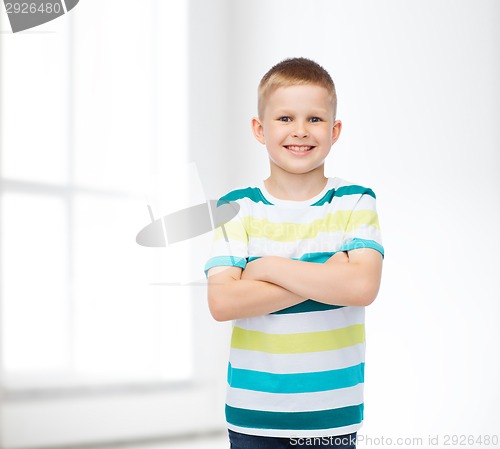 Image of little boy in casual clothes with arms crossed