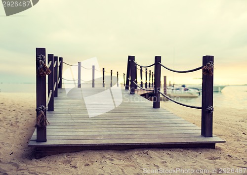 Image of close up of pier on tropical beach