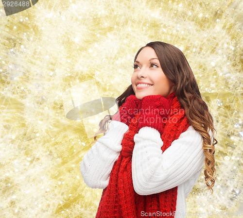 Image of smiling young woman in winter clothes