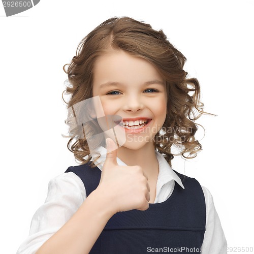 Image of pre-teen girl showing thumbs up