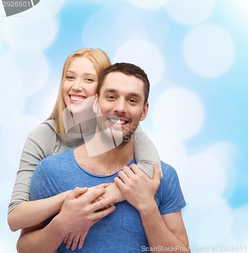 Image of smiling couple hugging