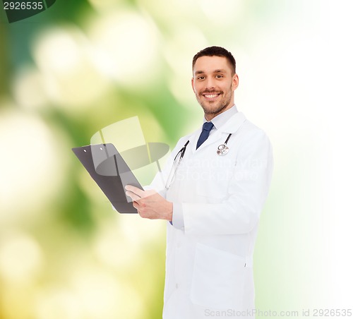 Image of smiling male doctor with clipboard and stethoscope