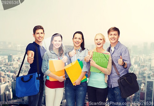 Image of group of smiling students showing thumbs up
