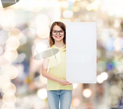 Image of little girl wearing eyeglasses with blank board