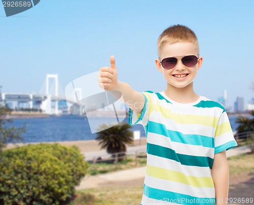 Image of smiling cute little boy in sunglasses