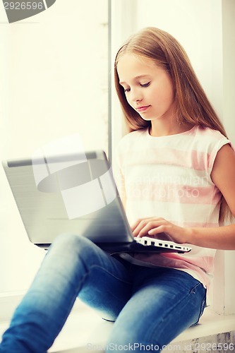 Image of girl with laptop pc at school