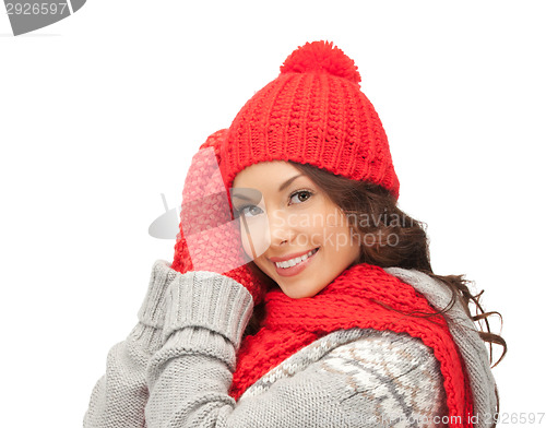 Image of beautiful asian woman in hat, scarf and mittens