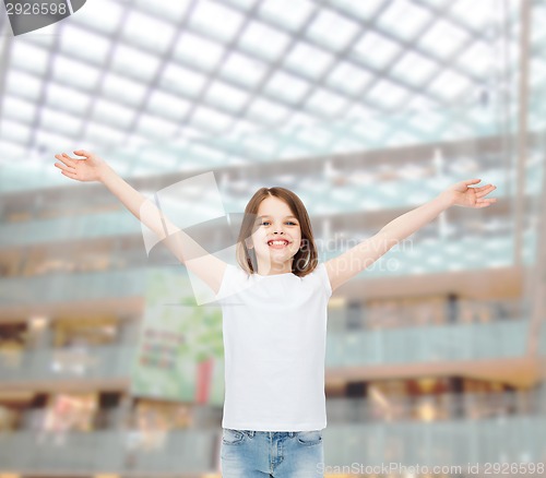 Image of smiling little girl in white blank t-shirt