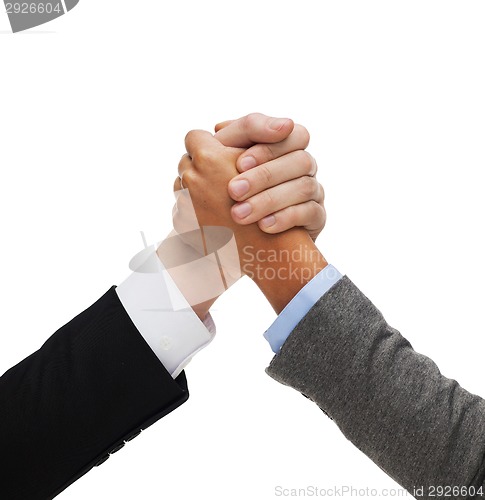 Image of hands of two people armwrestling