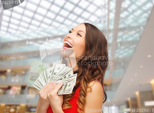 Image of woman in red dress with us dollar money