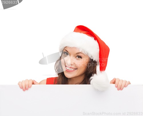 Image of woman in santa helper hat with blank white board