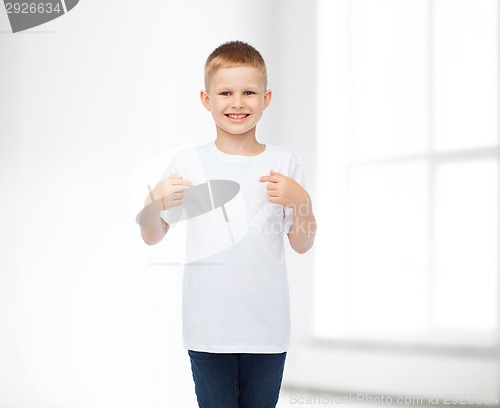Image of smiling little boy in white blank t-shirt
