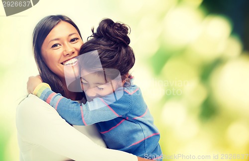 Image of hugging mother and daughter