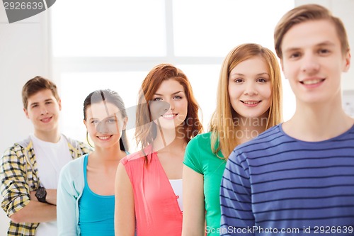 Image of smiling male student with group of classmates