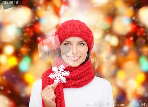 Image of smiling young woman in winter clothes