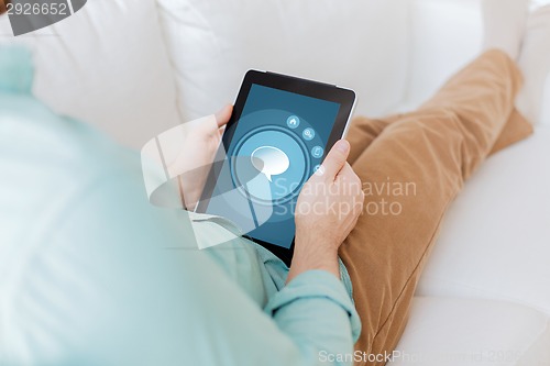 Image of close up of man with tablet pc computer at home