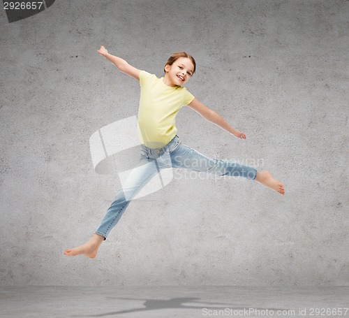 Image of smiling little girl jumping