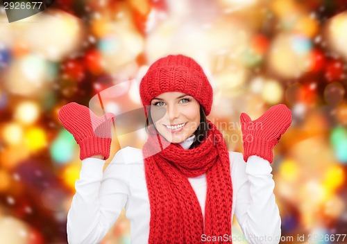 Image of smiling young woman in winter clothes