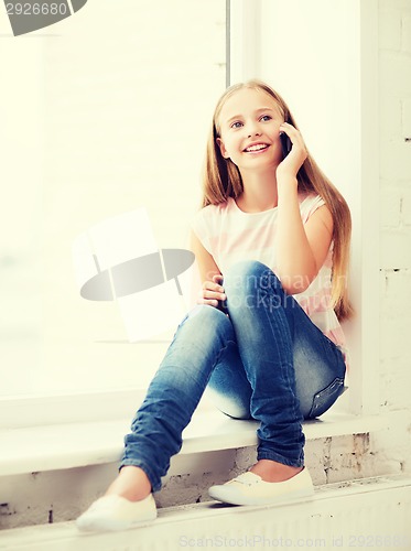 Image of girl with smartphone at school