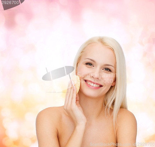 Image of beautiful woman with sponge