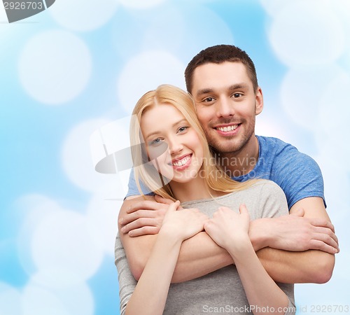 Image of smiling couple hugging