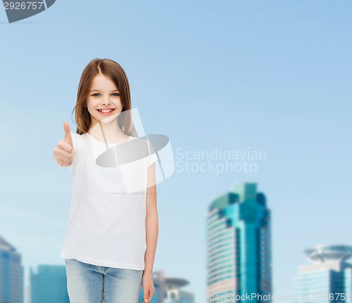 Image of smiling little girl in white blank t-shirt