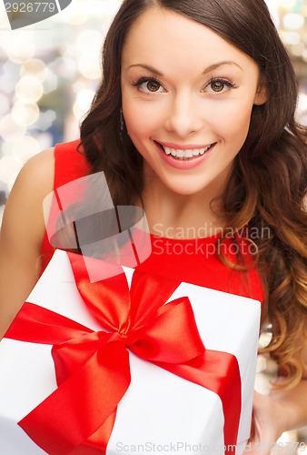 Image of close up of smiling woman with gift box