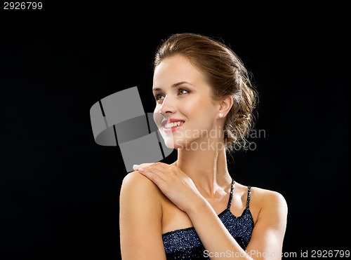 Image of smiling woman in evening dress