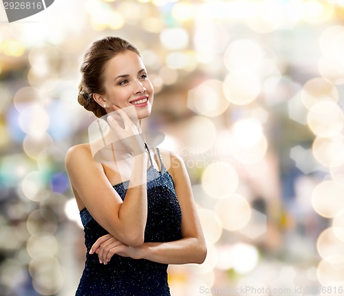 Image of smiling woman in evening dress