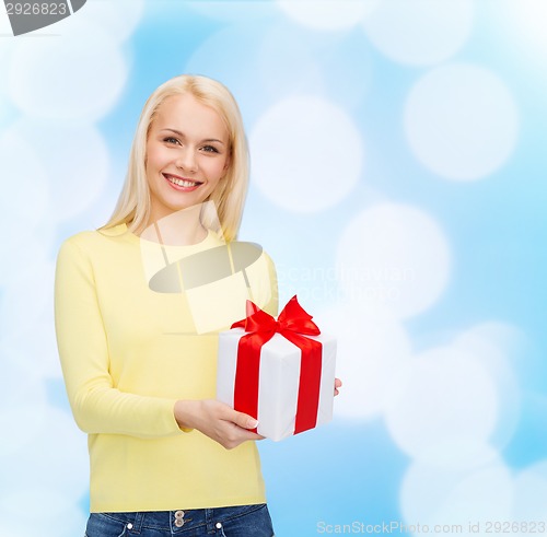 Image of smiling girl with gift box
