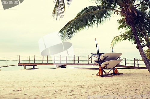 Image of surfboards on tropical beach