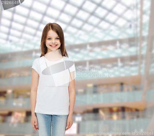 Image of smiling little girl in white blank t-shirt