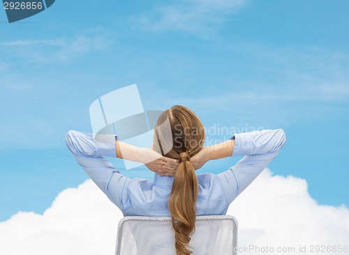 Image of businesswoman sitting on chair from back
