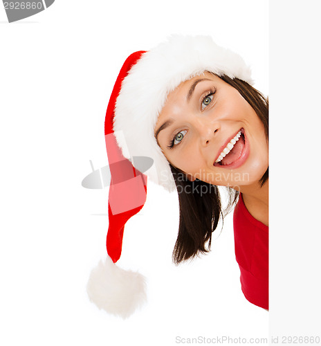 Image of woman in santa helper hat with blank white board