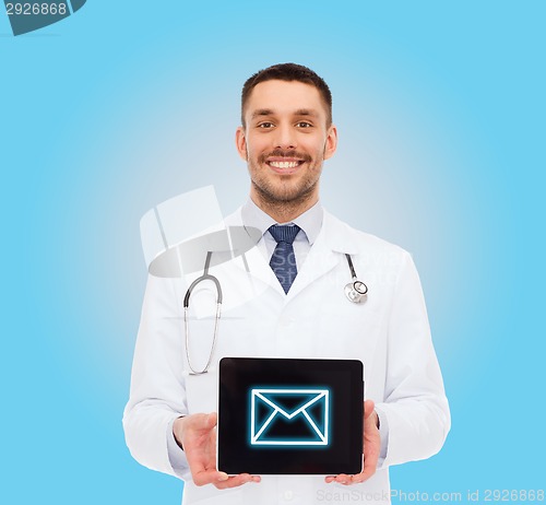 Image of smiling male doctor with tablet pc