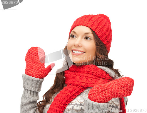 Image of beautiful asian woman in hat, scarf and mittens