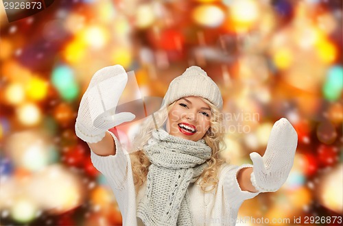 Image of smiling young woman in winter clothes